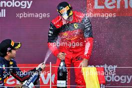 Race winner Carlos Sainz Jr (ESP) Ferrari celebrates on the podium with Sergio Perez (MEX) Red Bull Racing. 03.07.2022. Formula 1 World Championship, Rd 10, British Grand Prix, Silverstone, England, Race Day.
