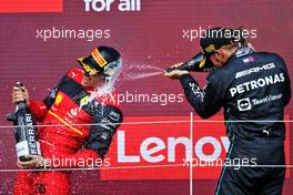 Race winner Carlos Sainz Jr (ESP) Ferrari celebrates on the podium with Lewis Hamilton (GBR) Mercedes AMG F1. 03.07.2022. Formula 1 World Championship, Rd 10, British Grand Prix, Silverstone, England, Race Day.