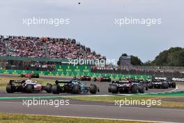 Kevin Magnussen (DEN) Haas VF-22 and Sebastian Vettel (GER) Aston Martin F1 Team AMR22. 03.07.2022. Formula 1 World Championship, Rd 10, British Grand Prix, Silverstone, England, Race Day.