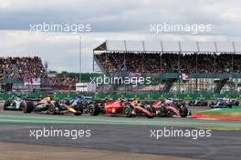 (L to R): Max Verstappen (NLD) Red Bull Racing RB18 with Carlos Sainz Jr (ESP) Ferrari F1-75 and Charles Leclerc (MON) Ferrari F1-75. 03.07.2022. Formula 1 World Championship, Rd 10, British Grand Prix, Silverstone, England, Race Day.