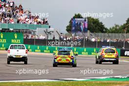 Police on the circuit at the start of the race as an incident involving people attempting to enter the circuit. 03.07.2022. Formula 1 World Championship, Rd 10, British Grand Prix, Silverstone, England, Race Day.