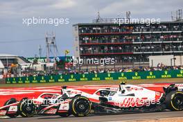 Kevin Magnussen (DEN) Haas VF-22 and Mick Schumacher (GER) Haas VF-22 battle for position. 03.07.2022. Formula 1 World Championship, Rd 10, British Grand Prix, Silverstone, England, Race Day.
