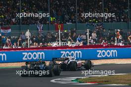 Kevin Magnussen (DEN) Haas VF-22 leads Nicholas Latifi (CDN) Williams Racing FW44. 03.07.2022. Formula 1 World Championship, Rd 10, British Grand Prix, Silverstone, England, Race Day.