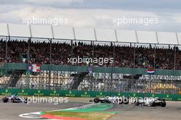 Yuki Tsunoda (JPN) AlphaTauri AT03 and Pierre Gasly (FRA) AlphaTauri AT03 spin off the track. 03.07.2022. Formula 1 World Championship, Rd 10, British Grand Prix, Silverstone, England, Race Day.