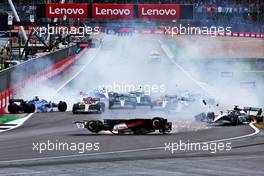 Guanyu Zhou (CHN) Alfa Romeo F1 Team C42 crashes at the start of the race. 03.07.2022. Formula 1 World Championship, Rd 10, British Grand Prix, Silverstone, England, Race Day.