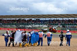 Guanyu Zhou (CHN) Alfa Romeo F1 Team is taken away on a stretcher into an ambulance after he crashed at the start of the race. 03.07.2022. Formula 1 World Championship, Rd 10, British Grand Prix, Silverstone, England, Race Day.