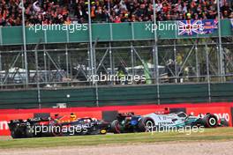 Lewis Hamilton (GBR) Mercedes AMG F1 W13; Sergio Perez (MEX) Red Bull Racing RB18; and Charles Leclerc (MON) Ferrari F1-75, battle for position. 03.07.2022. Formula 1 World Championship, Rd 10, British Grand Prix, Silverstone, England, Race Day.