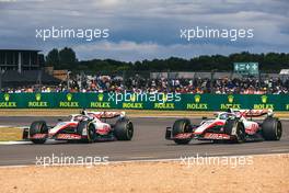 (L to R): Kevin Magnussen (DEN) Haas VF-22 and Mick Schumacher (GER) Haas VF-22 battle for position. 03.07.2022. Formula 1 World Championship, Rd 10, British Grand Prix, Silverstone, England, Race Day.