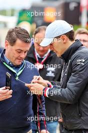 George Russell (GBR) Mercedes AMG F1 signs autographs for the fans. 02.07.2022. Formula 1 World Championship, Rd 10, British Grand Prix, Silverstone, England, Qualifying Day.