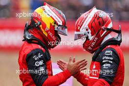 (L to R): Carlos Sainz Jr (ESP) Ferrari celebrates his pole position in qualifying parc ferme with team mate Charles Leclerc (MON) Ferrari. 02.07.2022. Formula 1 World Championship, Rd 10, British Grand Prix, Silverstone, England, Qualifying Day.