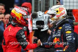 (L to R): Carlos Sainz Jr (ESP) Ferrari celebrates his pole position with second placed Max Verstappen (NLD) Red Bull Racing in qualifying parc ferme. 02.07.2022. Formula 1 World Championship, Rd 10, British Grand Prix, Silverstone, England, Qualifying Day.
