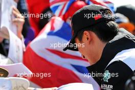 Guanyu Zhou (CHN) Alfa Romeo F1 Team with fans. 03.07.2022. Formula 1 World Championship, Rd 10, British Grand Prix, Silverstone, England, Race Day.