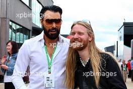 (L to R): Rylan Clark (GBR) TV Presenter with Sam Ryder (GBR) Singer. 03.07.2022. Formula 1 World Championship, Rd 10, British Grand Prix, Silverstone, England, Race Day.
