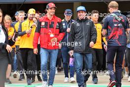 (L to R): Carlos Sainz Jr (ESP) Ferrari with Fernando Alonso (ESP) Alpine F1 Team on the drivers parade. 03.07.2022. Formula 1 World Championship, Rd 10, British Grand Prix, Silverstone, England, Race Day.