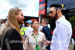 (L to R): Sam Ryder (GBR) Singer with his partner Lois Gaskin-Barber (GBR), and Rylan Clark (GBR) TV Presenter. 03.07.2022. Formula 1 World Championship, Rd 10, British Grand Prix, Silverstone, England, Race Day.