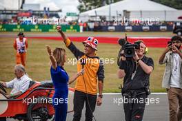 Lando Norris (GBR) McLaren with Natalie Pinkham (GBR) Sky Sports Presenter on the drivers parade. 03.07.2022. Formula 1 World Championship, Rd 10, British Grand Prix, Silverstone, England, Race Day.