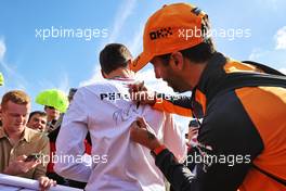 Daniel Ricciardo (AUS) McLaren signs his autograph for George Russell (GBR) Mercedes AMG F1. 03.07.2022. Formula 1 World Championship, Rd 10, British Grand Prix, Silverstone, England, Race Day.