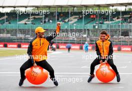 (L to R): Daniel Ricciardo (AUS) McLaren with team mate Lando Norris (GBR) McLaren. 30.06.2022. Formula 1 World Championship, Rd 10, British Grand Prix, Silverstone, England, Preparation Day.