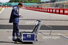 Circuit atmosphere - AlphaTauri engineer. 30.06.2022. Formula 1 World Championship, Rd 10, British Grand Prix, Silverstone, England, Preparation Day.