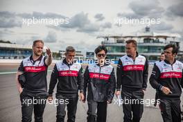 Guanyu Zhou (CHN) Alfa Romeo F1 Team walks the circuit with the team. 30.06.2022. Formula 1 World Championship, Rd 10, British Grand Prix, Silverstone, England, Preparation Day.