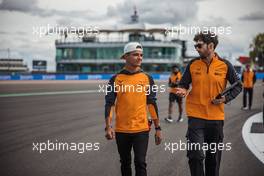 Lando Norris (GBR) McLaren walks the circuit with Jose Manuel Lopez Garcia (ESP) McLaren Lead Performance Engineer. 30.06.2022. Formula 1 World Championship, Rd 10, British Grand Prix, Silverstone, England, Preparation Day.