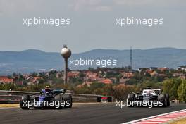 Nicholas Latifi (CDN) Williams Racing FW44 and Pierre Gasly (FRA) AlphaTauri AT03. 29.07.2022. Formula 1 World Championship, Rd 13, Hungarian Grand Prix, Budapest, Hungary, Practice Day.