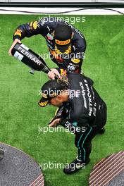 Race winner Max Verstappen (NLD) Red Bull Racing celebrates with second placed Lewis Hamilton (GBR) Mercedes AMG F1 on the podium. 31.07.2022. Formula 1 World Championship, Rd 13, Hungarian Grand Prix, Budapest, Hungary, Race Day.