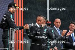 (L to R): second placed George Russell (GBR) Mercedes AMG F1 celebrates with third placed Lewis Hamilton (GBR) Mercedes AMG F1 on the podium. 31.07.2022. Formula 1 World Championship, Rd 13, Hungarian Grand Prix, Budapest, Hungary, Race Day.
