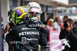 Race winner Max Verstappen (NLD) Red Bull Racing celebrates with second placed Lewis Hamilton (GBR) Mercedes AMG F1 in parc ferme. 31.07.2022. Formula 1 World Championship, Rd 13, Hungarian Grand Prix, Budapest, Hungary, Race Day.