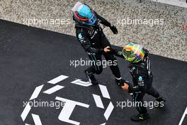 (L to R): George Russell (GBR) Mercedes AMG F1 celebrates his third position with second placed team mate Lewis Hamilton (GBR) Mercedes AMG F1 in parc ferme. 31.07.2022. Formula 1 World Championship, Rd 13, Hungarian Grand Prix, Budapest, Hungary, Race Day.
