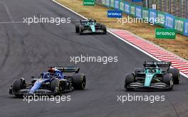 (L to R): Alexander Albon (THA) Williams Racing FW44 and Lance Stroll (CDN) Aston Martin F1 Team AMR22 battle for position. 31.07.2022. Formula 1 World Championship, Rd 13, Hungarian Grand Prix, Budapest, Hungary, Race Day.