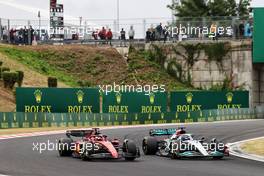 Charles Leclerc (MON) Ferrari F1-75 and George Russell (GBR) Mercedes AMG F1 W13 battle for the lead of the race. 31.07.2022. Formula 1 World Championship, Rd 13, Hungarian Grand Prix, Budapest, Hungary, Race Day.