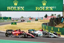 Charles Leclerc (MON) Ferrari F1-75 and George Russell (GBR) Mercedes AMG F1 W13 battle for position. 31.07.2022. Formula 1 World Championship, Rd 13, Hungarian Grand Prix, Budapest, Hungary, Race Day.
