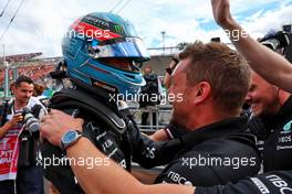 George Russell (GBR) Mercedes AMG F1 celebrates his pole position in qualifying parc ferme with the team. 30.07.2022. Formula 1 World Championship, Rd 13, Hungarian Grand Prix, Budapest, Hungary, Qualifying Day.