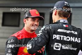(L to R): Charles Leclerc (MON) Ferrari with pole sitter George Russell (GBR) Mercedes AMG F1 in qualifying parc ferme. 30.07.2022. Formula 1 World Championship, Rd 13, Hungarian Grand Prix, Budapest, Hungary, Qualifying Day.