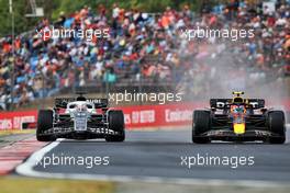 Pierre Gasly (FRA) AlphaTauri AT03 and Sergio Perez (MEX) Red Bull Racing RB18. 30.07.2022. Formula 1 World Championship, Rd 13, Hungarian Grand Prix, Budapest, Hungary, Qualifying Day.