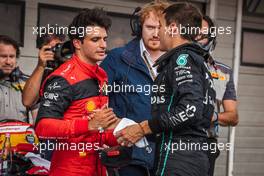 George Russell (GBR) Mercedes AMG F1 (Right) celebrates his pole position in qualifying parc ferme with second placed Carlos Sainz Jr (ESP) Ferrari. 30.07.2022. Formula 1 World Championship, Rd 13, Hungarian Grand Prix, Budapest, Hungary, Qualifying Day.