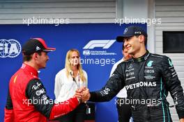 George Russell (GBR) Mercedes AMG F1 (Right) celebrates his pole position in qualifying parc ferme with third placed Charles Leclerc (MON) Ferrari. 30.07.2022. Formula 1 World Championship, Rd 13, Hungarian Grand Prix, Budapest, Hungary, Qualifying Day.