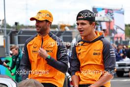 (L to R): Daniel Ricciardo (AUS) McLaren and team mate Lando Norris (GBR) McLaren on the drivers parade. 31.07.2022. Formula 1 World Championship, Rd 13, Hungarian Grand Prix, Budapest, Hungary, Race Day.