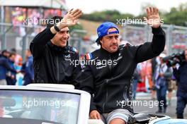 (L to R): Esteban Ocon (FRA) Alpine F1 Team and team mate Fernando Alonso (ESP) Alpine F1 Team on the drivers parade. 31.07.2022. Formula 1 World Championship, Rd 13, Hungarian Grand Prix, Budapest, Hungary, Race Day.