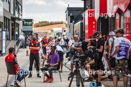 (L to R): Carlos Sainz Jr (ESP) Ferrari with Lawrence Barretto (GBR) Formula 1 Senior Writer Editor. 28.07.2022. Formula 1 World Championship, Rd 13, Hungarian Grand Prix, Budapest, Hungary, Preparation Day.