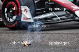 An Alfa Romeo F1 Team C42 passes some smoking debris from the Williams Racing FW44 of Alexander Albon (THA). 22.04.2022. Formula 1 World Championship, Rd 4, Emilia Romagna Grand Prix, Imola, Italy, Qualifying Day.