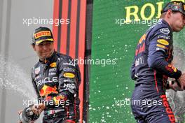 (L to R): Sergio Perez (MEX) Red Bull Racing celebrates his second position on the podium with team mate and race winner Max Verstappen (NLD) Red Bull Racing. 24.04.2022. Formula 1 World Championship, Rd 4, Emilia Romagna Grand Prix, Imola, Italy, Race Day.