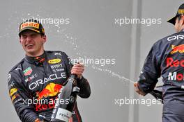 Race winner Max Verstappen (NLD) Red Bull Racing celebrates on the podium with team mate Max Verstappen (NLD) Red Bull Racing. 24.04.2022. Formula 1 World Championship, Rd 4, Emilia Romagna Grand Prix, Imola, Italy, Race Day.
