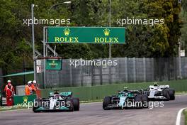 George Russell (GBR) Mercedes AMG F1 W13 and Sebastian Vettel (GER) Aston Martin F1 Team AMR22 battle for position. 23.04.2022. Formula 1 World Championship, Rd 4, Emilia Romagna Grand Prix, Imola, Italy, Sprint Day.