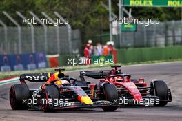 Max Verstappen (NLD) Red Bull Racing RB18 passes Charles Leclerc (MON) Ferrari F1-75 for the lead. 23.04.2022. Formula 1 World Championship, Rd 4, Emilia Romagna Grand Prix, Imola, Italy, Sprint Day.
