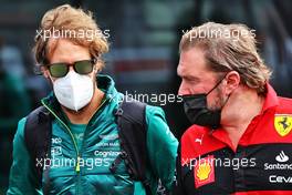 (L to R): Sebastian Vettel (GER) Aston Martin F1 Team with Gino Rosato (CDN) Ferrari. 24.04.2022. Formula 1 World Championship, Rd 4, Emilia Romagna Grand Prix, Imola, Italy, Race Day.