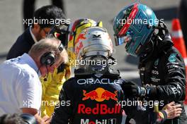 (L to R): Charles Leclerc (MON) Ferrari and George Russell (GBR) Mercedes AMG F1 in parc ferme with race winner Max Verstappen (NLD) Red Bull Racing. 11.09.2022. Formula 1 World Championship, Rd 16, Italian Grand Prix, Monza, Italy, Race Day.
