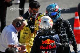 (L to R): Charles Leclerc (MON) Ferrari and George Russell (GBR) Mercedes AMG F1 in parc ferme with race winner Max Verstappen (NLD) Red Bull Racing. 11.09.2022. Formula 1 World Championship, Rd 16, Italian Grand Prix, Monza, Italy, Race Day.