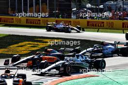 Lando Norris (GBR) McLaren MCL36 and Pierre Gasly (FRA) AlphaTauri AT03 battle for position. 11.09.2022. Formula 1 World Championship, Rd 16, Italian Grand Prix, Monza, Italy, Race Day.